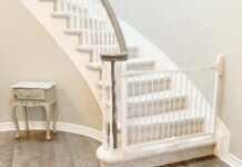 Gate maven safety gate install example - white safety gate at the bottom of the stairs